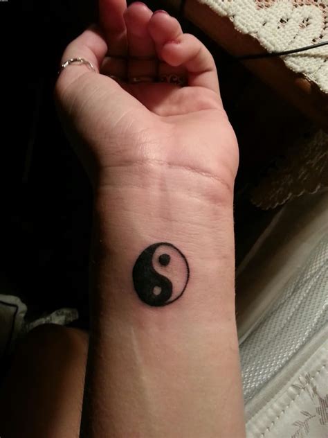 yin yang wrist tattoo